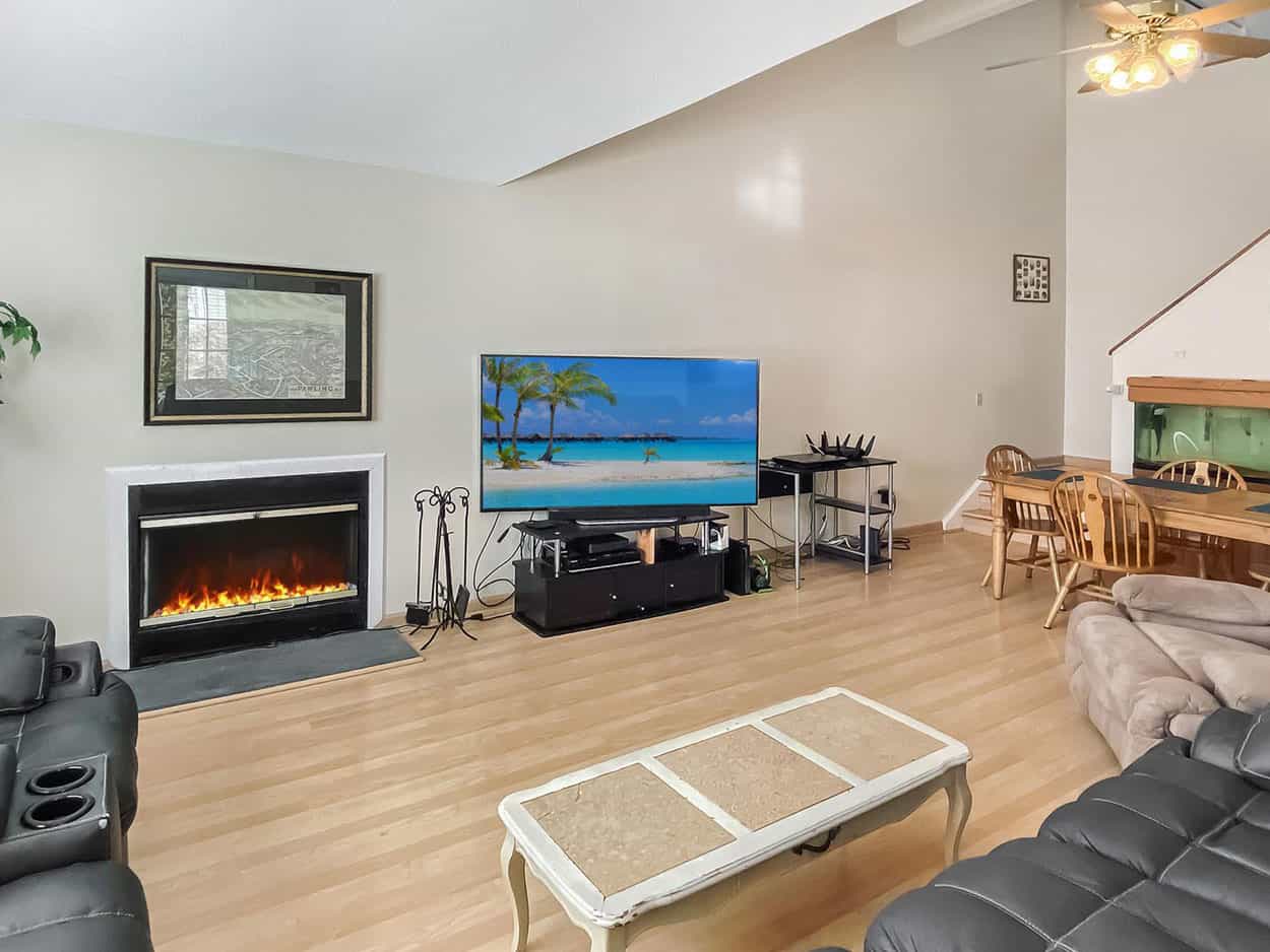 real estate photo editing fire place and tv screen after